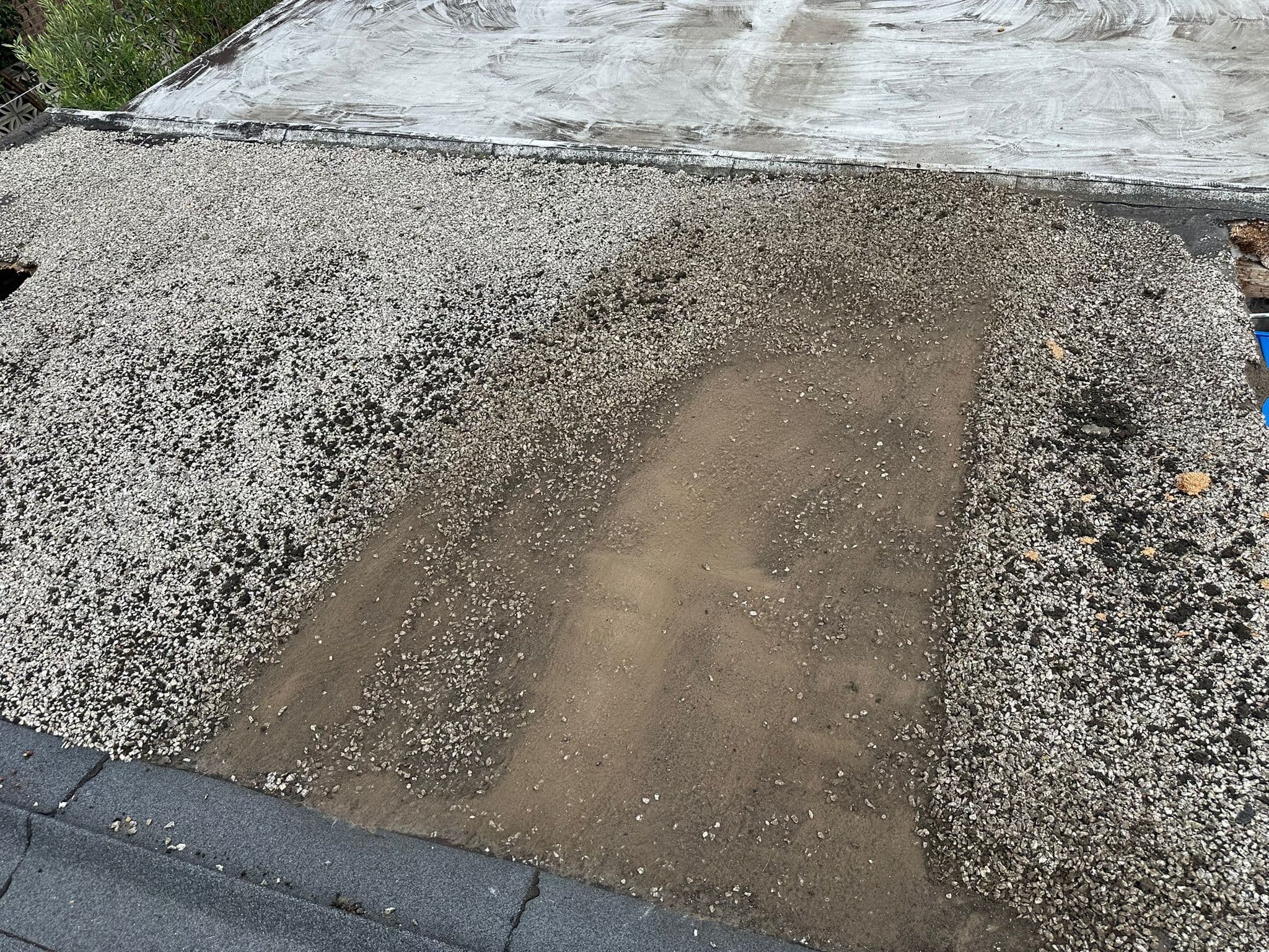 Standing water and worn covering on a flat roof