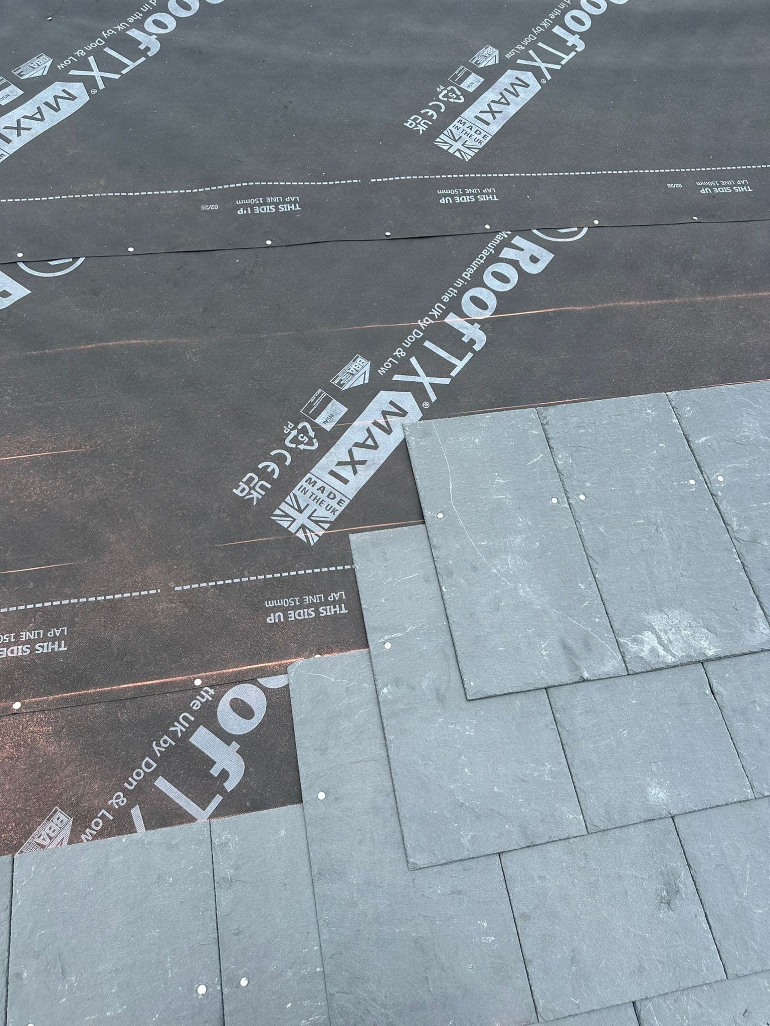 Slate being laid on a Cumbrian roof